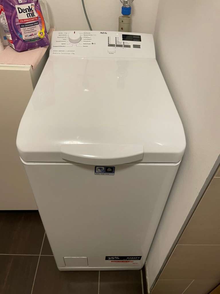 Kostenlose Lieferung und Installation der AEG Lavamat Toplader Waschmaschine, präsentiert von SparTechnik24.